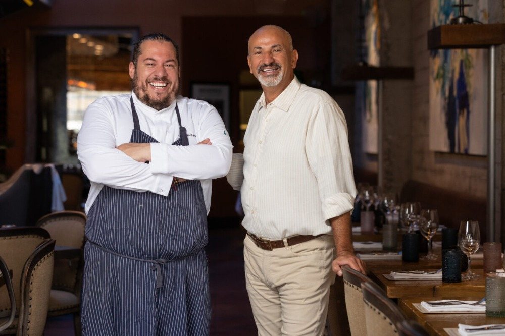 Chef Amar Santana and Ahmed together inside Broadway restaurant